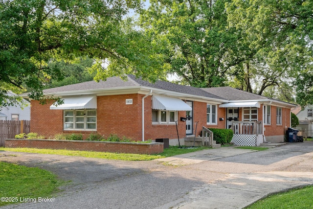1833 Farnsley Rd, Louisville, KY 40216 - view of front of home with brick siding and asphalt driveway