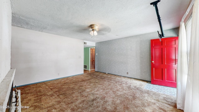 116 E Southern Heights Ave, Louisville, KY 40214 - carpeted spare room with a textured ceiling and a ceiling fan