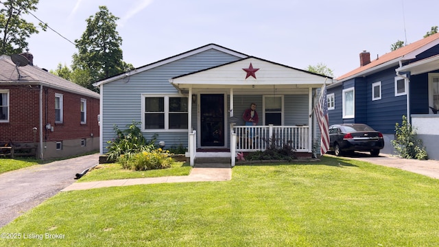 116 E Southern Heights Ave, Louisville, KY 40214 - bungalow-style home featuring a porch, a front yard, and asphalt driveway