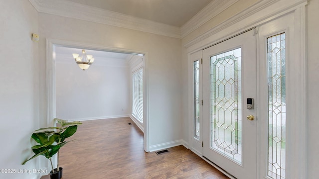 4301 Juniper Forest Pl, Louisville, KY 40245 - foyer featuring ornamental molding, wood finished floors, and a chandelier