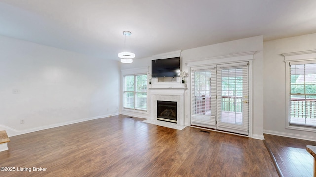 4301 Juniper Forest Pl, Louisville, KY 40245 - unfurnished living room with wood finished floors, plenty of natural light, and a high end fireplace