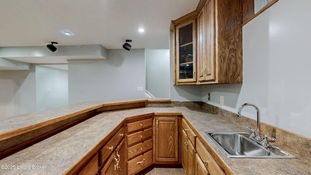4301 Juniper Forest Pl, Louisville, KY 40245 - kitchen featuring glass insert cabinets, light countertops, a peninsula, brown cabinets, and recessed lighting