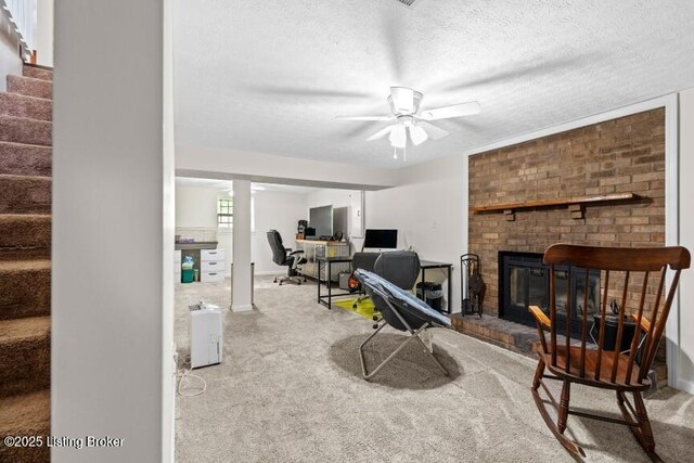 1376 Darlene Ct, Radcliff, KY 40160 - living room featuring stairs, carpet floors, ceiling fan, a desk, and a textured ceiling