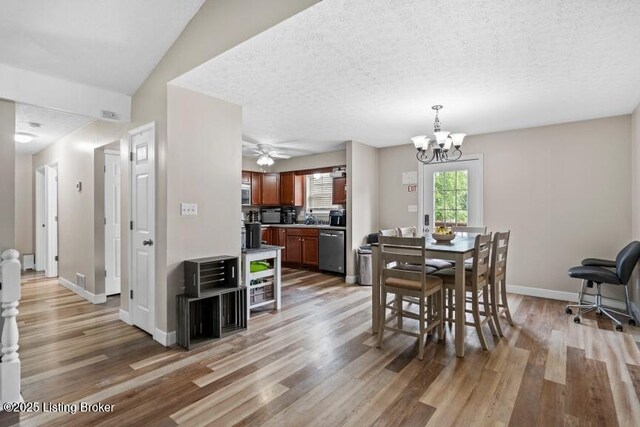 1376 Darlene Ct, Radcliff, KY 40160 - dining space with light wood-type flooring, a chandelier, and a ceiling fan