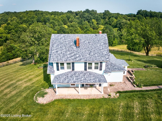 3591 Bardstown Rd, Lawrenceburg, KY 40342 - view of front of house with a patio, a chimney, and a wooded view
