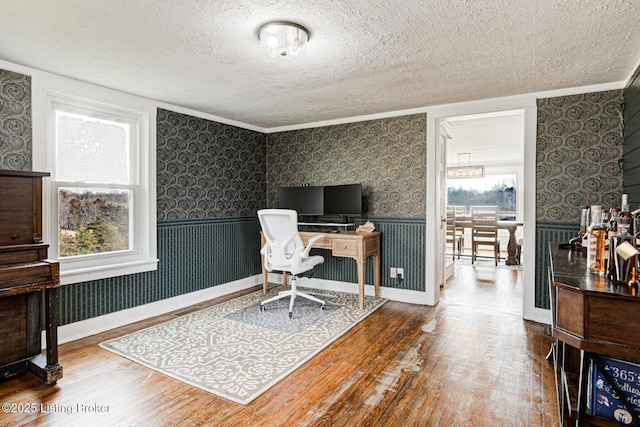 3591 Bardstown Rd, Lawrenceburg, KY 40342 - office area with wood finished floors, a textured ceiling, wallpapered walls, wainscoting, and ornamental molding