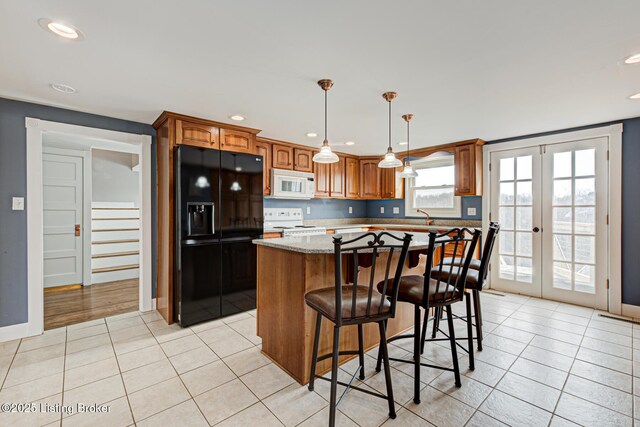 3591 Bardstown Rd, Lawrenceburg, KY 40342 - kitchen featuring white appliances, a kitchen island, french doors, light tile patterned floors, and hanging light fixtures