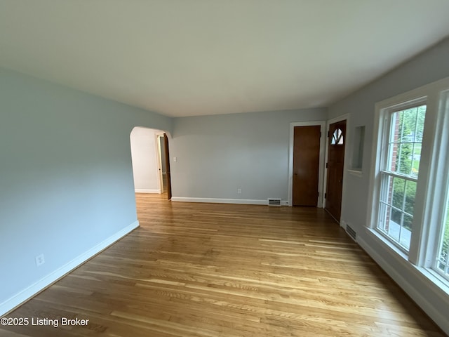 230 Tyne Rd, Louisville, KY 40207 - spare room featuring arched walkways and light wood-type flooring