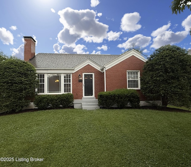 230 Tyne Rd, Louisville, KY 40207 - view of front of home with a front lawn, a chimney, brick siding, and a shingled roof