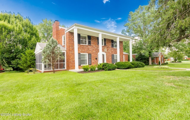 8613 Whipps Bend Rd, Bellemeade, KY 40222 - neoclassical / greek revival house with a chimney, a front lawn, a sunroom, and brick siding
