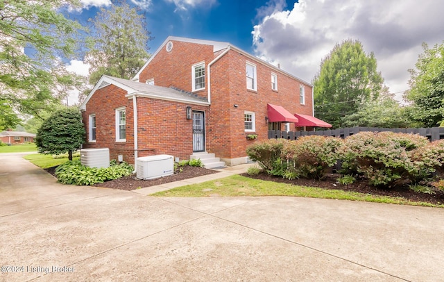 8613 Whipps Bend Rd, Bellemeade, KY 40222 - view of home's exterior featuring brick siding
