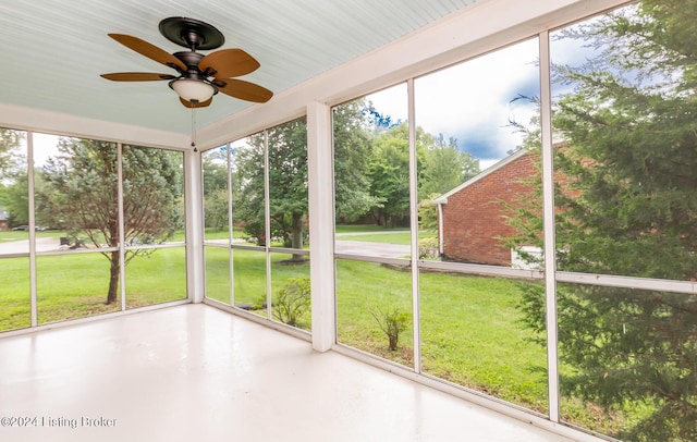 8613 Whipps Bend Rd, Bellemeade, KY 40222 - unfurnished sunroom with a ceiling fan and view of scattered trees