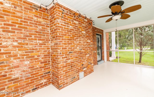 8613 Whipps Bend Rd, Bellemeade, KY 40222 - unfurnished sunroom with brick wall and a ceiling fan