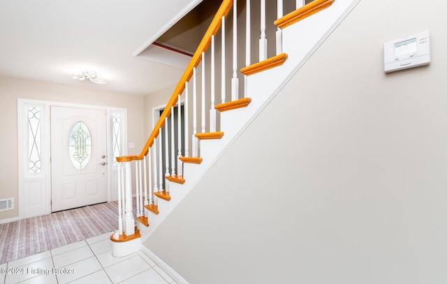 8613 Whipps Bend Rd, Bellemeade, KY 40222 - foyer with tile patterned flooring, stairs, and carpet floors