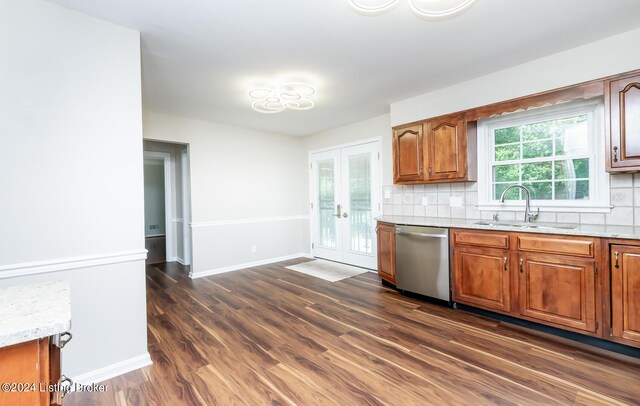8613 Whipps Bend Rd, Bellemeade, KY 40222 - kitchen with dishwasher, backsplash, and brown cabinetry