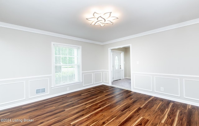 8613 Whipps Bend Rd, Bellemeade, KY 40222 - unfurnished room featuring dark wood-style flooring, ornamental molding, a decorative wall, and wainscoting