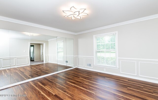 8613 Whipps Bend Rd, Bellemeade, KY 40222 - empty room featuring a decorative wall, ornamental molding, wood finished floors, plenty of natural light, and a wainscoted wall