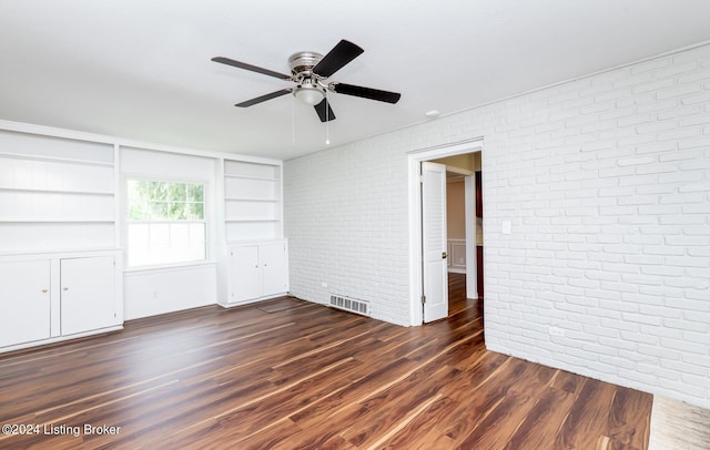 8613 Whipps Bend Rd, Bellemeade, KY 40222 - unfurnished room with brick wall, ceiling fan, dark wood-type flooring, and built in features