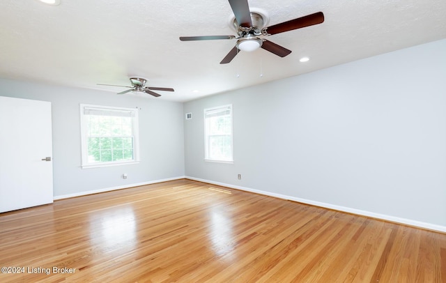 8613 Whipps Bend Rd, Bellemeade, KY 40222 - empty room featuring plenty of natural light, light wood-type flooring, and recessed lighting