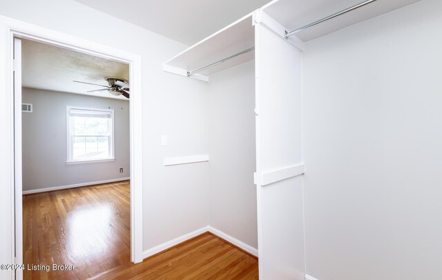8613 Whipps Bend Rd, Bellemeade, KY 40222 - walk in closet featuring wood finished floors and a ceiling fan