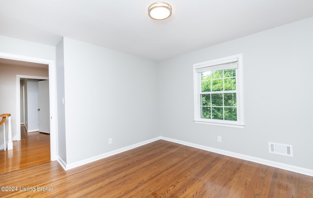 8613 Whipps Bend Rd, Bellemeade, KY 40222 - spare room featuring baseboards and wood finished floors