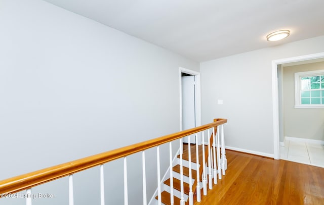 8613 Whipps Bend Rd, Bellemeade, KY 40222 - hall featuring an upstairs landing and light wood-style floors