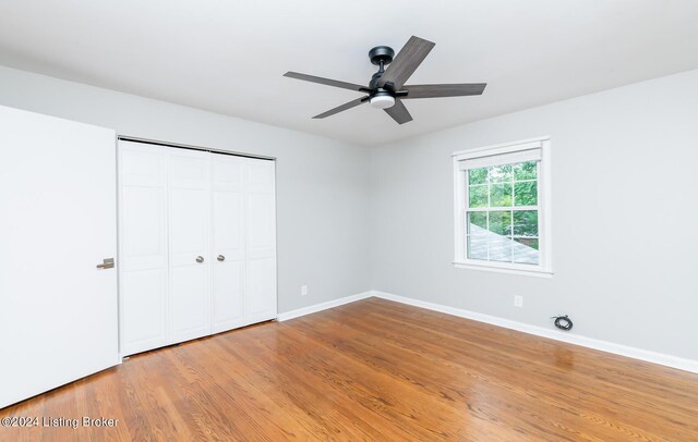 8613 Whipps Bend Rd, Bellemeade, KY 40222 - unfurnished bedroom featuring light wood-style flooring, a closet, and a ceiling fan