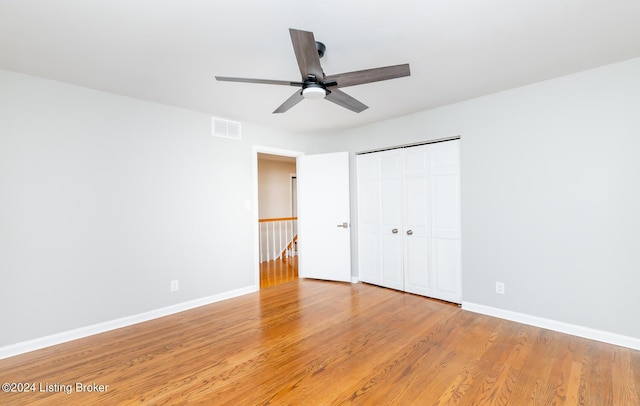 8613 Whipps Bend Rd, Bellemeade, KY 40222 - unfurnished bedroom with light wood-style floors, a closet, and a ceiling fan