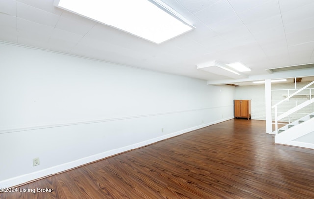 8613 Whipps Bend Rd, Bellemeade, KY 40222 - finished below grade area with dark wood-type flooring and stairway