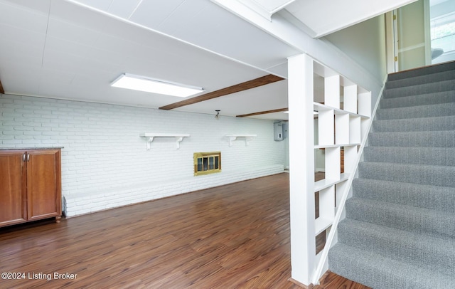 8613 Whipps Bend Rd, Bellemeade, KY 40222 - finished basement featuring stairway, dark wood finished floors, electric panel, and brick wall