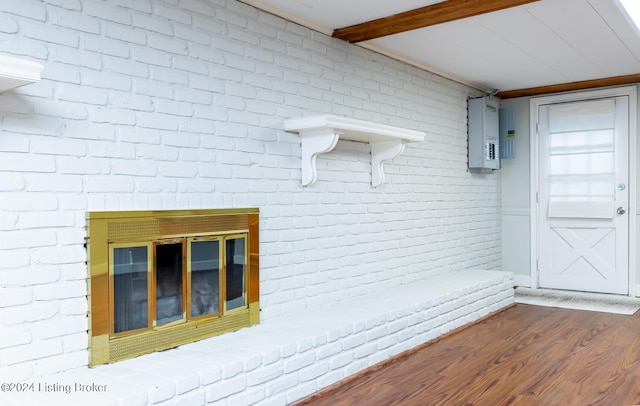 8613 Whipps Bend Rd, Bellemeade, KY 40222 - detailed view of electric panel, wood finished floors, and brick wall