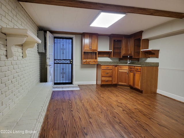 8613 Whipps Bend Rd, Bellemeade, KY 40222 - kitchen featuring open shelves, dark wood finished floors, brick wall, brown cabinets, and beamed ceiling