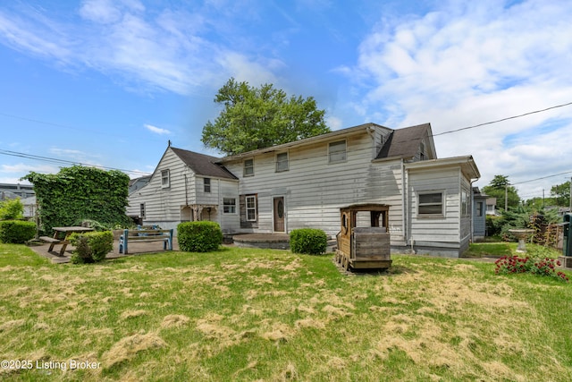 1736 W Gaulbert Ave, Louisville, KY 40210 - rear view of property featuring a yard