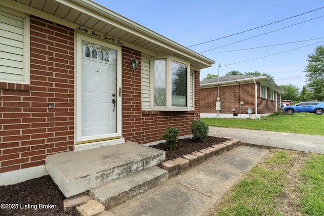 6325 Hackberry Way, Louisville, KY 40229 - property entrance featuring brick siding and a lawn