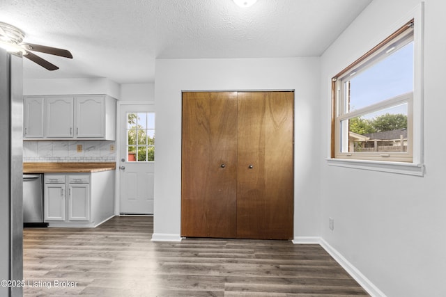 6325 Hackberry Way, Louisville, KY 40229 - kitchen with stainless steel dishwasher, ceiling fan, wood finished floors, a textured ceiling, and tasteful backsplash