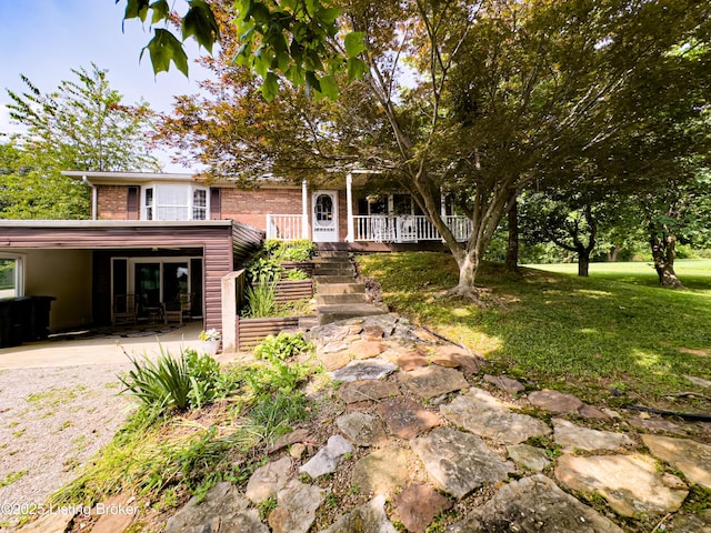 2866 Sunbeam Rd, Leitchfield, KY 42754 - view of front of house with brick siding, a front lawn, stairway, and a patio area
