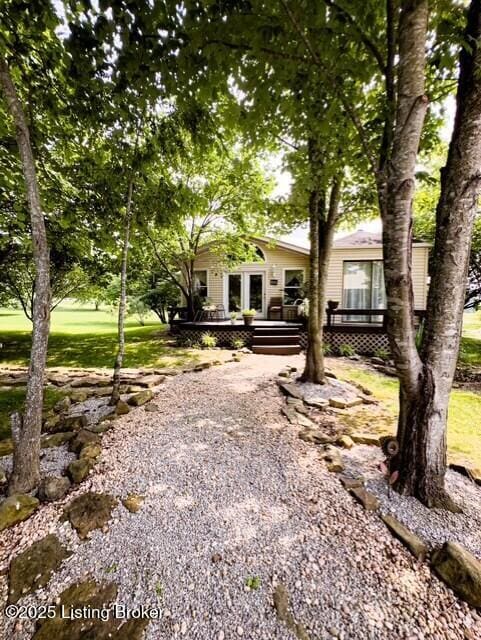 2866 Sunbeam Rd, Leitchfield, KY 42754 - view of property hidden behind natural elements with a wooden deck