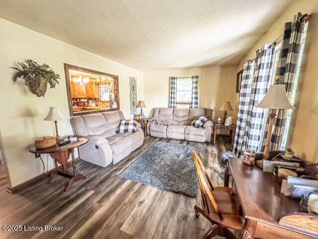 2866 Sunbeam Rd, Leitchfield, KY 42754 - living area featuring wood finished floors and a textured ceiling