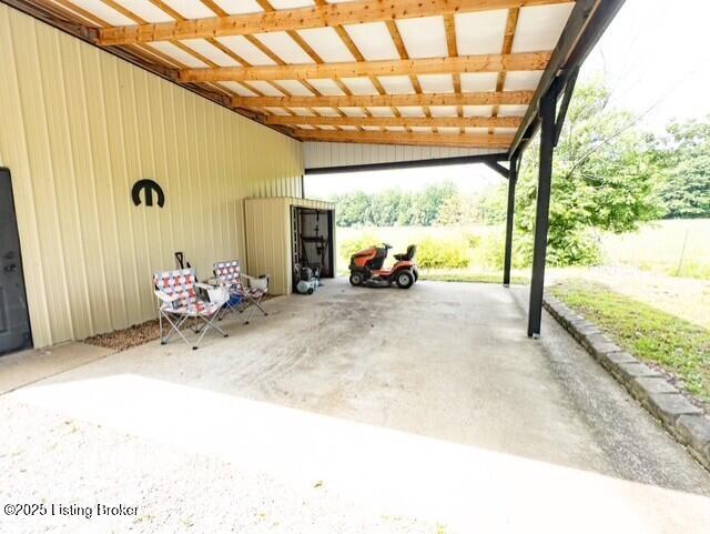 2866 Sunbeam Rd, Leitchfield, KY 42754 - garage with a carport