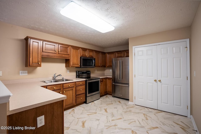 1003 Persimmon Pl, La Grange, KY 40031 - kitchen with stainless steel appliances, light marble finish flooring, light countertops, brown cabinetry, and a peninsula