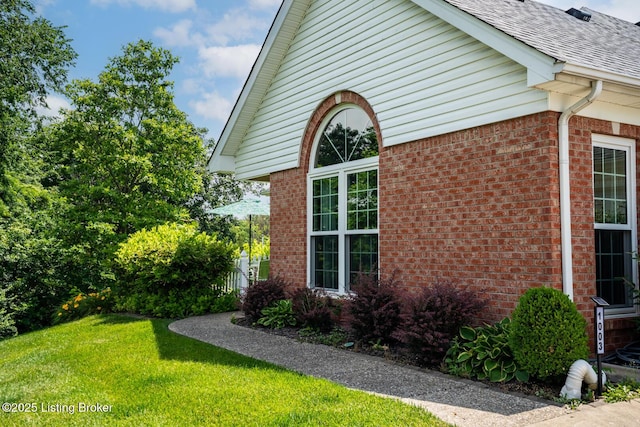 1003 Persimmon Pl, La Grange, KY 40031 - view of home's exterior featuring brick siding, a yard, and roof with shingles
