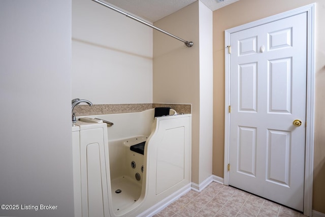 1003 Persimmon Pl, La Grange, KY 40031 - full bathroom with a tub with jets and baseboards