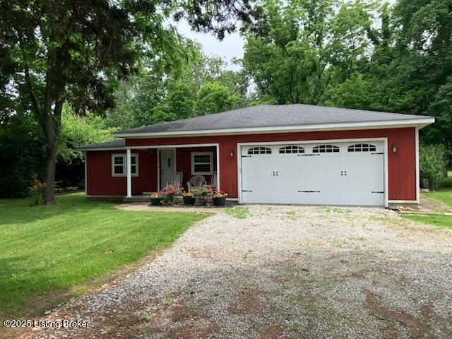1102 W Hebron Ln, Shepherdsville, KY 40165 - single story home with driveway, covered porch, a front lawn, view of scattered trees, and a garage