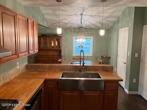 1102 W Hebron Ln, Shepherdsville, KY 40165 - kitchen featuring dishwasher, a peninsula, vaulted ceiling, hanging light fixtures, and dark wood finished floors