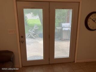 1102 W Hebron Ln, Shepherdsville, KY 40165 - entryway featuring light tile patterned floors, french doors, and healthy amount of natural light