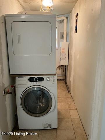 1102 W Hebron Ln, Shepherdsville, KY 40165 - laundry room featuring stacked washer / dryer, light tile patterned floors, and water heater