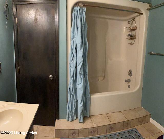 1102 W Hebron Ln, Shepherdsville, KY 40165 - bathroom featuring tile patterned floors, shower / tub combo, and vanity