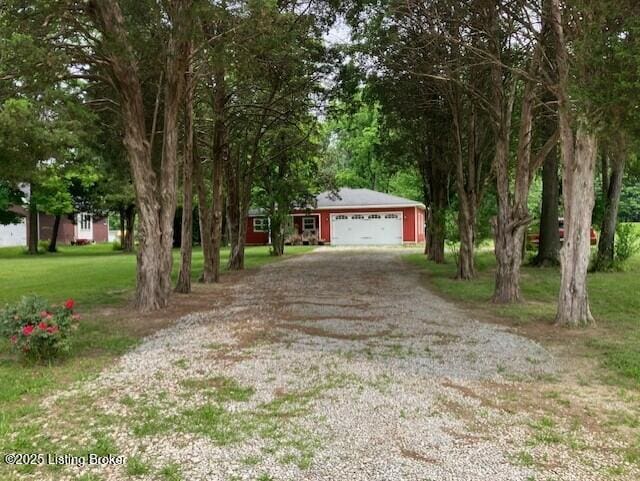 1102 W Hebron Ln, Shepherdsville, KY 40165 - view of front of home with gravel driveway and an attached garage