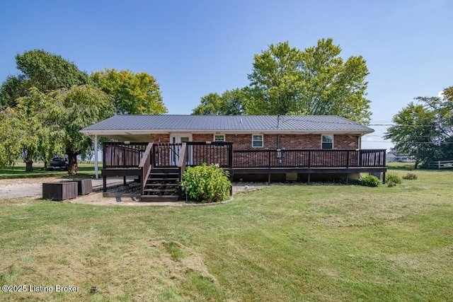 10563 S Dixie Hwy, Sonora, KY 42776 - rear view of property featuring brick siding, a yard, and a wooden deck