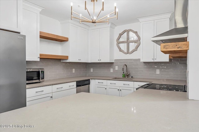 5800 Coach Gate Wynde Unit 312D, Louisville, KY 40207 - kitchen with wall chimney range hood, appliances with stainless steel finishes, open shelves, a chandelier, and decorative backsplash